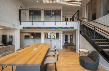 Co-working lounge with free wifi, reservable conference rooms, coffee bar, and commercial printer